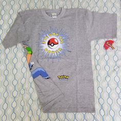 New Vintage 90s Pokemon Pokeball Ash T Shirt I've Got The Power All Over Print Wrap Around Mega Print Size Youth Xl, Fits About An Adult Medium (See Measurements In Description) New With Tags Really Rare Shirt True Vintage From The 90s Single Stitched Hard To Find This Tee In Sizes That Fit Adults Awesome Wrap Around Graphic Of Ash Throwing A Pokeball Really Unique Piece Measurements: Pit To Pit: 19.5 Inches Collar To Bottom Seam: 27.5 Inches Relaxed Fit Short Sleeve Throwback Tops, 90s Style Streetwear Tops With Pockets, 90s Streetwear Tops With Pockets, Throwback Cotton Short Sleeve Tops, 90s Pokemon, All Over Color, Pokemon Shirts, Crazy Wrap Thing, The 90s