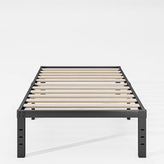 a bed frame with wooden slats and black metal legs on an isolated white background