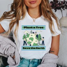 Looking for the perfect gardening shirt? Look no further than our new t-shirt, designed to inspire everyone to plant for a greener tomorrow. Made with soft and breathable cotton, this comfortable t-shirt features a bold graphic design with the message "Plant a Tree Save the Earth". It's the perfect gift for any plant lover or gardener who cares about making a positive impact on the environment. Whether you wear it while tending to your garden or out and about, you can proudly show your support f White Screen Print Top For Earth Day, Earth Day Screen Print Short Sleeve Tops, Short Sleeve T-shirt With Plants Print For Gardening, Eco-friendly Graphic Print Top For Earth Day, Eco-friendly Cotton T-shirt For Earth Day, Casual Graphic Print Shirt For Earth Day, Casual Shirt With Graphic Print For Earth Day, Cotton T-shirt With Letter Print For Earth Day, Green Cotton T-shirt For Earth Day