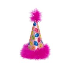 a party hat with pink fur trim and candy buttons on it, sitting on a white surface