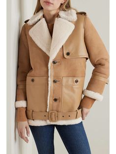 FRAME Belted leather-trimmed shearling jacket | NET-A-PORTER Chic Shearling Leather Jacket For Work, Chic Shearling Leather Jacket With Faux Fur Trim, Chic Brown Shearling Outerwear, Chic Shearling Leather Jacket With Long Sleeves, Luxury Beige Outerwear With Faux Fur Lining, Shearling Leather Jacket With Faux Fur Trim For Work, Designer Shearling Outerwear For Work, Chic Shearling Leather Jacket For Winter, Chic Shearling Outerwear For Fall