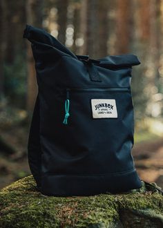 "Perfect for all you adventurers. Plenty of room to pack for a weekend away & added laptop compartment if you need to work on the go. 100% recycled polyester roll top rucksack finished with a woven patch & paracord zipper pull. Featuring a padded laptop compartment, compatible up to 15.6\". Small front zipper pocket for quick access things (keys, phone, wallet) + padded back panel, base & adjustable shoulder straps. -100% Recycled 600D Polyester -Recycled Polyester made from 100% rPET -Equivalent to 12 post-consumer bottles -PVC free -Padded back & base panels -Padded adjustable shoulder straps -Webbed grab handle -Rolled top -Clip fastening -Front zippered pocket -Padded laptop compartment -Laptop compatible up to 15.6\" -Water resistant lining -Paracord zip pullers Size: 32 x 44 x 13cm C Waterproof Backpack For Outdoor Activities, Waterproof Black Backpack For Adventure, Black Waterproof Backpack For Adventure, Black Standard Backpack For Adventure, Durable Black Bags For Adventure, Black Practical Backpack For Adventure, Practical Black Backpack For Adventure, Black Standard Backpack For Camping, Black Camping Backpack