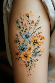 a woman's thigh with flowers painted on it