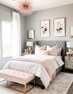 a bedroom with gray walls and pink accents