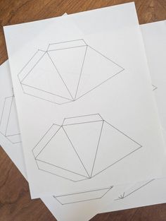 three pieces of paper are laying on top of each other with lines drawn across them