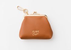 "The perfect pouch to carry your smaller items for safekeeping. Place your AirPods, keys, or spare change in the Mary Coin Pouch and you'll be good to go! Bag Details: Made with Premium Vegan Leather 1 Deep main pocket Dims: 8\"(H) X 18\"(L) 6\"(W) Weight: 1.8 oz." Coin Purse With Key Clip, Personal Use Coin Purse With Key Clip, Pouch Coin Purse With Key Clip For Personal Use, Daily Use Key Clip Wallet Pouch, Daily Use Wallet With Key Clip And Pouch Shape, Daily Use Wallets With Key Clip And Pouch Shape, Everyday Coin Purse With Interior Key Chain Holder, Pouch Bag With Key Clip As Gift, Pouch Bag With Key Clip For Gift