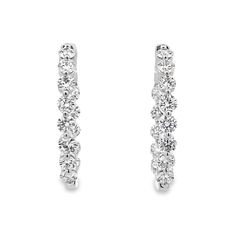 Elevate your elegance with our 14K White Gold Hoop Earrings, showcasing 4.0 carats total weight of lab-grown diamonds. These hoops feature an inside-outside style, ensuring a dazzling display of brilliance from every angle. Each lab-grown diamond is meticulously set to maximize sparkle and shine, creating a luxurious and modern look. Crafted from high-quality 14K white gold, these earrings are designed for both beauty and durability. Perfect for any occasion, they add a touch of sophistication a White Gold Hoop Earrings, White Gold Hoops, Inside Outside, Gold Hoop, Gold Hoop Earrings, Lab Diamonds, Lab Grown, Lab Grown Diamonds, Diamond Earrings