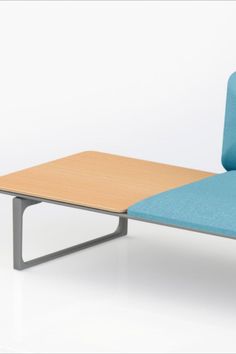 a blue chair with a wooden table on it's back end and side view