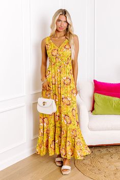 - Stay stylish in this boho beauty! - Unlined lightweight material with a colorful abstract floral print - A v-cut neckline - A strapless cut - An open v-cut back with a tie detail - A stretchy elastic waistline - A flowy yet flattering silhouette that ends in a straight ankle length hemline Measurements S : Bust 34", Hip 46", Length 53", Waist 24-34". M : Bust 36", Hip 48", Length 53.5", Waist 26-36". L : Bust 38", Hip 50", Length 54", Waist 28-38". Yellow Boho Print Maxi Dress For Spring, Yellow Sundress With Smocked Back For Vacation, Yellow Bohemian Maxi Dress With Vibrant Print, Bohemian Yellow Printed Sundress, Yellow Beach Sundress With Smocked Back, Yellow Sundress With Smocked Back For Beach, Yellow Floral Print Maxi Dress For Vacation, Yellow Bohemian Sundress For Day Out, Yellow Flowy Bohemian Sundress