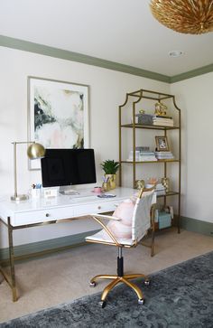 a desk with a computer on it in a room