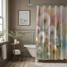 a bathroom with a bathtub, shower curtain and rug