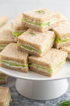 cucumber sandwiches stacked on top of each other with text overlay that reads, cucumber sandwiches little sunny kitchen