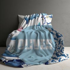 an image of a blanket with the word denver printed on it in blue and white