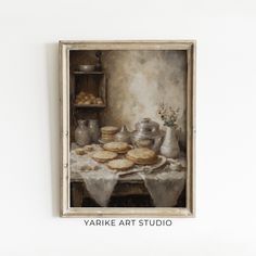 a painting on the wall of a kitchen with cookies and other items in front of it