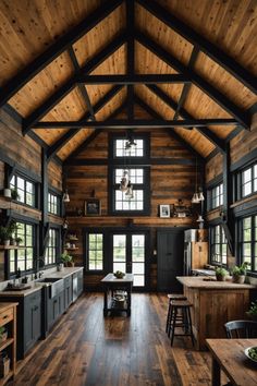 a large open kitchen with wooden walls and ceiling, along with dark wood flooring