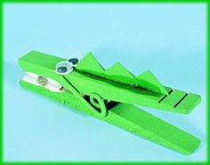 an origami model of a green airplane