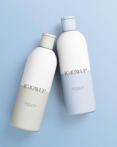 two bottles of liquid sitting next to each other on a light blue background with the word iglowup written in white