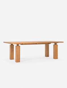 a wooden table sitting on top of a white floor