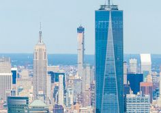 an aerial view of the city with skyscrapers and other tall buildings in the background