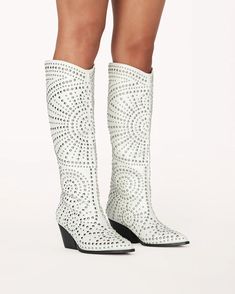 Zachariah by Billini is a statement embellished long boot. Go full glam in this silver studded long boot, the ideal style to elevate your festival outfit or off-duty look. Featuring; low stacked block heel closed pointed toe structured upper silver stud embellishments in statement design synthetic upper, lining and out Knee High Western Boots, Last Rodeo, Cowgirl Look, Full Glam, Glass Slippers, Western Style Boots, White Studs, Rush Dresses, Studded Boots