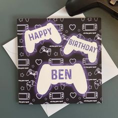 a birthday card with two video game controllers on it