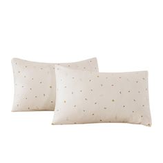 two white pillows with small dots on them