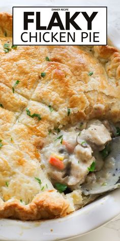 a close up of a pie on a plate with the words flaky chicken pie