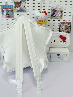 Introducing the Cute HELLO KITTY White Backpack! This Star Shaped Design Backpack is perfect for women and girls who love all things kawaii. With its oversized design, it offers plenty of space to carry your essentials. The iconic Sanrio Kitty adds a touch of cuteness to your everyday style. Whether you're heading to school, a day out, or a fun adventure, this backpack is a must-have accessory for any Hello Kitty fan. Show off your love for all things adorable with this kawaii backpack! 🌸🎒 👜A White Hello Kitty School Backpack, White Hello Kitty Backpack In Kawaii Style, White Hello Kitty Print Backpack, Cute Hello Kitty Standard Backpack, Kawaii Pink Hello Kitty Backpack, Design Backpack, Kawaii Bag, Kawaii Backpack, White Backpack