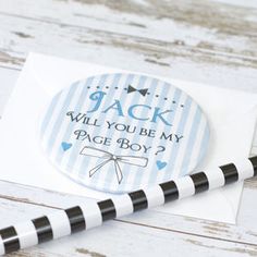 a blue and white striped sticker with the words jack will you be my page boy?