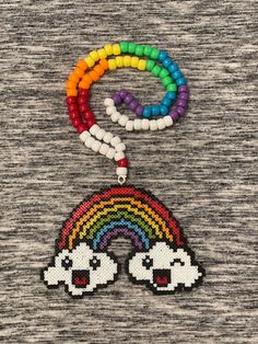 Super cute mini Kandi Necklace with clouds and a rainbow! Matching chain. Fun Rainbow Necklaces For Gifts, Fun Rainbow Necklace For Gifts, Fun Rainbow Necklace For Gift, Cute Multicolor Beaded Chain Necklace, Fun Rainbow Colored Necklace For Gift, Fun Rainbow Necklaces With Colorful Beads, Rainbow Kawaii Jewelry For Gift, Cute Rainbow Beaded Necklace For Gift, Cute Multicolor Beaded Necklaces