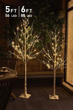 three lighted trees in front of a window with the words, 5ft 6ft