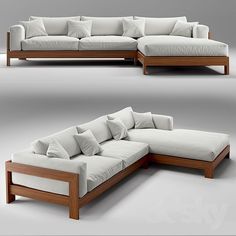 this is an image of a couch made out of wood and white fabric with pillows