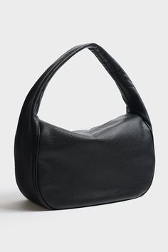 Product Details The Halo Day in grain black features a sleek hobo bag form with a slender shape and sponged strap, constructed with comfort at its core. The minimal style of this shoulder bag comes with full zip closure suited for use as a work bag, travel bag or comfortable everyday bag. Renowned for its quality and style, for those who appreciate both form and function. This bag is exclusively handmade in the A-ESQUE Melbourne Atelier from the finest soft Italian aniline pebble grain leather. Versatile Soft Leather Hobo Bag For Business, Black Smooth Grain Hobo Bag For Everyday, Modern Textured Leather Baguette Bag For Travel, Black Smooth Grain Hobo Bag For Business, Sleek Textured Leather Bag For Everyday, Textured Leather Baguette Bag For Travel, Everyday Black Smooth Grain Hobo Bag, Sleek Black Hobo Bag For Everyday, Black Sleek Hobo Bag For Everyday Use