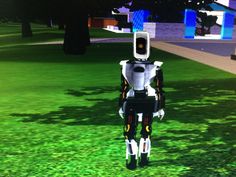 a robot standing in the middle of a field