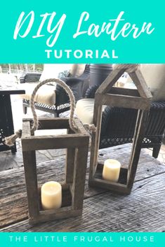 two lanterns sitting on top of a wooden table next to each other with candles in them