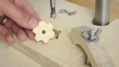 a person working with woodworking tools on a table