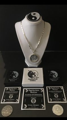 an assortment of coins and necklaces on display