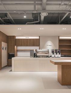 an empty kitchen with lots of counter space