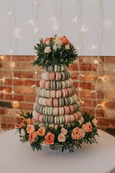 a wedding cake made out of macaroons and flowers