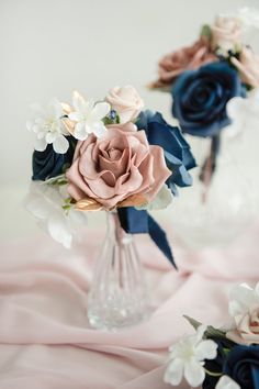 two vases filled with different colored flowers