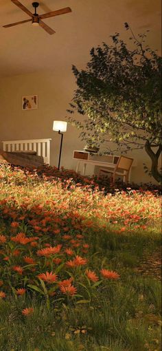 a living room filled with lots of flowers and a ceiling fan in the middle of it