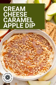 an apple dip in a white bowl surrounded by crackers and apples with the words cream cheese caramel dip above it