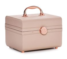 a pink suitcase with a handle on the top and handles at the bottom, sitting on a white surface