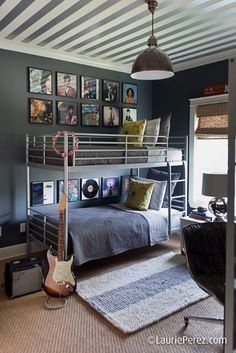 a bedroom with bunk beds and pictures on the wall