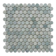 a white and blue mosaic tile with circles on it