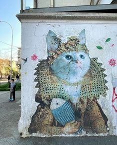 a cat painted on the side of a building