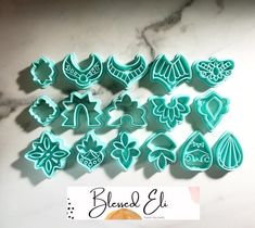 some cookie cutters are sitting on a counter with the words blend & el written above them