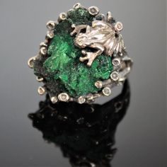 The ring of Melant is made manually of 925 sterling silver and natural plaid malachite. The ring is manually assembled directly on the stone. Each ring is individual and unique. The texture of plisse malachite resembles the interweaving of overgrown branches of a shrub, and the luster of the polished surface is akin to the dull flicker of twisted silk. Such a stone can be used in contrast with turquoise malachite - mainly as a low-expressive background. Malachite is a stone that perfectly combin Green Sterling Silver Nature-inspired Ring, Unique Collectible Sterling Silver Emerald Ring, Unique Sterling Silver Emerald Ring Collectible, Green Nature-inspired Sterling Silver Rings, Unique Silver Malachite Jewelry, Handmade Malachite Ring Jewelry, Unique Hand Cast Green Jewelry, Unique Green Hand Cast Jewelry, Unique Hand-cast Green Jewelry