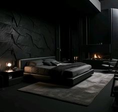 a bedroom with a bed, chair and fireplace in the dark night time room that is lit by candles