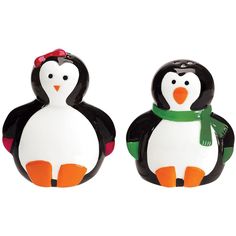 two penguin salt and pepper shakers on a white background